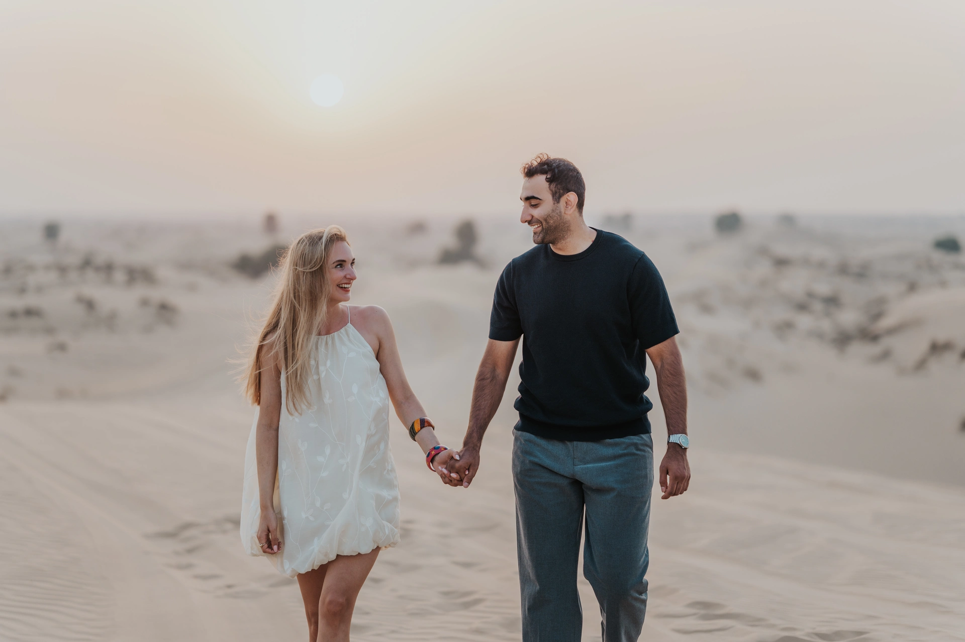 Dubai photoshoot of a couple in the desert dunes of Al Qudra